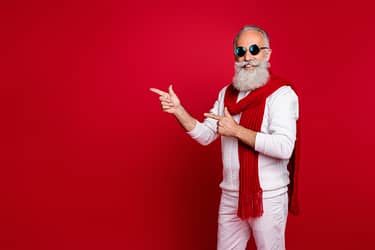 Portrait of his he nice attractive handsome confident cheerful classy, bearded gray-haired man demonstrating copy space ad advert solution isolated over bright vivid shine red background